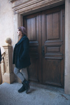 woman standing in a doorway