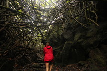 a woman hiking in a jungle 