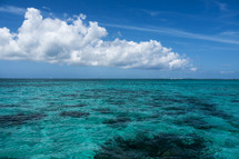 Clouds over the tropical ocean water.