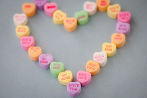 candy conversation hearts in the shape of a heart for Valentine's day 