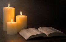 candles and opened Bible 