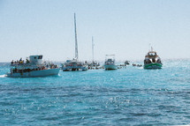 anchored boats in the water 