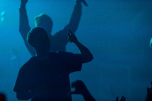 silhouette of a man at a concert 
