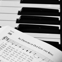 All Creature of Our God and King sheet music on a piano 