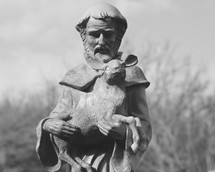 Statue of Saint Francis holding a deer 