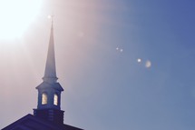 sunbeams on a church steeple 