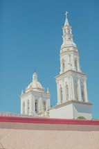 a church steeple in a blue sky 