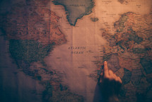 pointing to the middle east on a world map 
