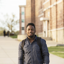 a young man on a college campus 
