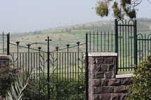 wrought iron fence in churchyard on the hills above the Sea of Galilee