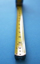 measuring tape on a blue background 