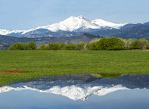 reflection of a snow capped volcanic mountain 