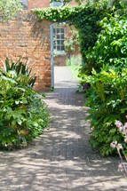 brick path through a garden 