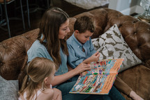 a mother reading to her children 