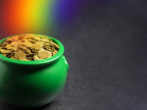 rainbow Pot Full of Golden Coins Isolated on a black Background