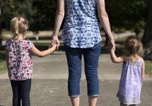 mother and daughters at a park 