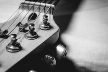 Close up from an old vintage guitar headstock , Full with dust. In black and white.