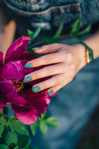 Creative vibrant pink nails art design, animalistic zebra pattern. Fuchsia color. Beautiful peony flower. High quality photo