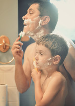 father and son shaving together 