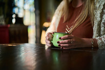 woman holding a coffee cup 