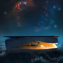 A woman in a large book reads by flashlight under a night sky