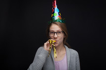 A woman wearing a party hat 