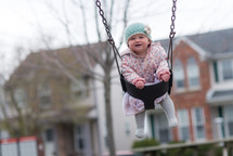 toddler in a swing 