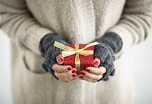 a woman holding a gift 