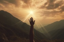 Hand reaching up to the sun in the mountains Faith, Hope and Worship