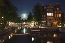 Bridge and boat in The moonlit Amsterdam