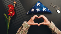 Heart symbol by a military for memorial day celebration