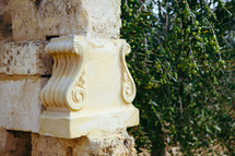 carved detail on a stone column 