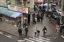 people standing on a city sidewalk 