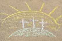 three Easter crosses on the mount in sidewalk chalk 