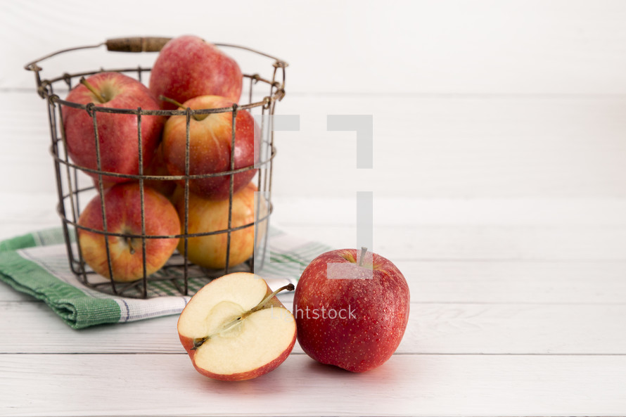 wire basket of red apples 