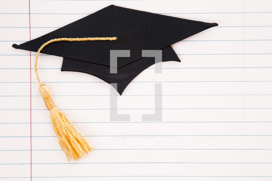 graduation cap on notebook paper 