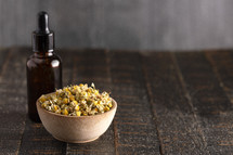 Chamomile Essential Oil with Dried Chamomile Flowers