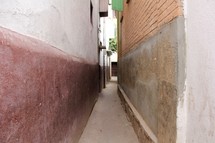 A narrow alley between buildings 
