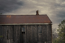 Old barn under a stormy sky.