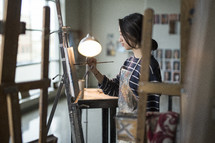 artist painting in a studio 