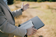 a minister preaching outdoors 