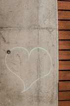 heart drawn in chalk on a wall 