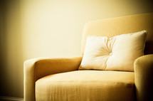 pillow on a yellow couch