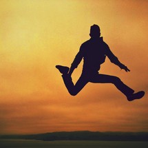 silhouette of a man jumping