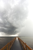 storm clouds over a pier 