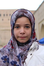 Young Yazidi girl with a shawl over her head  [For similar search 'Ethnic Face Smile' or 'Refugee']