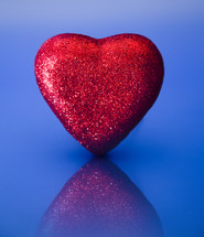 red glittery heart on blue 