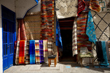 rugs at a market in Morocco 