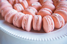 pink cookies on a silver tray 