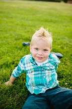 Boy playing in grass field